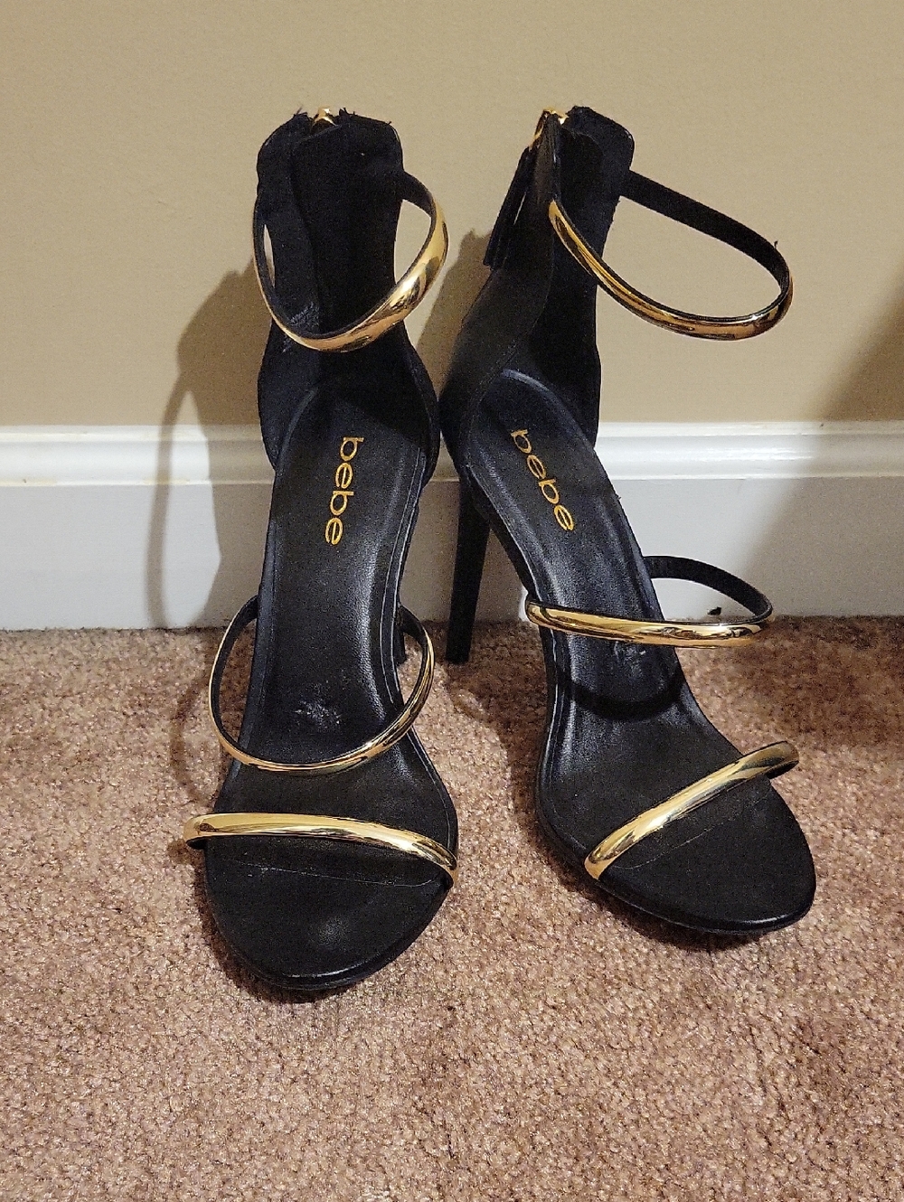 bebe Black Heeled Sandals with Gold Accent Straps